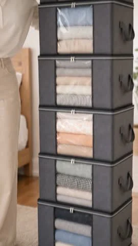 Moras AI video frame showing the clear fronts of stacked fabric storage boxes